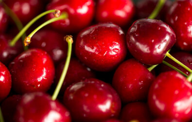 Close up image of cherries and stems