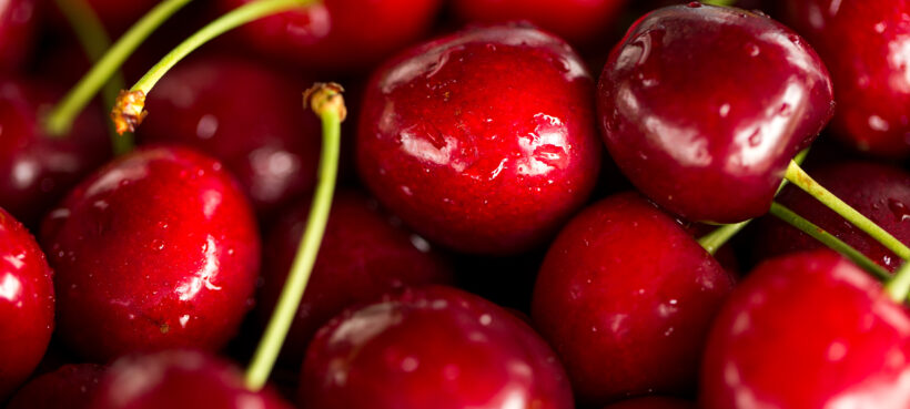 Close up image of cherries and stems