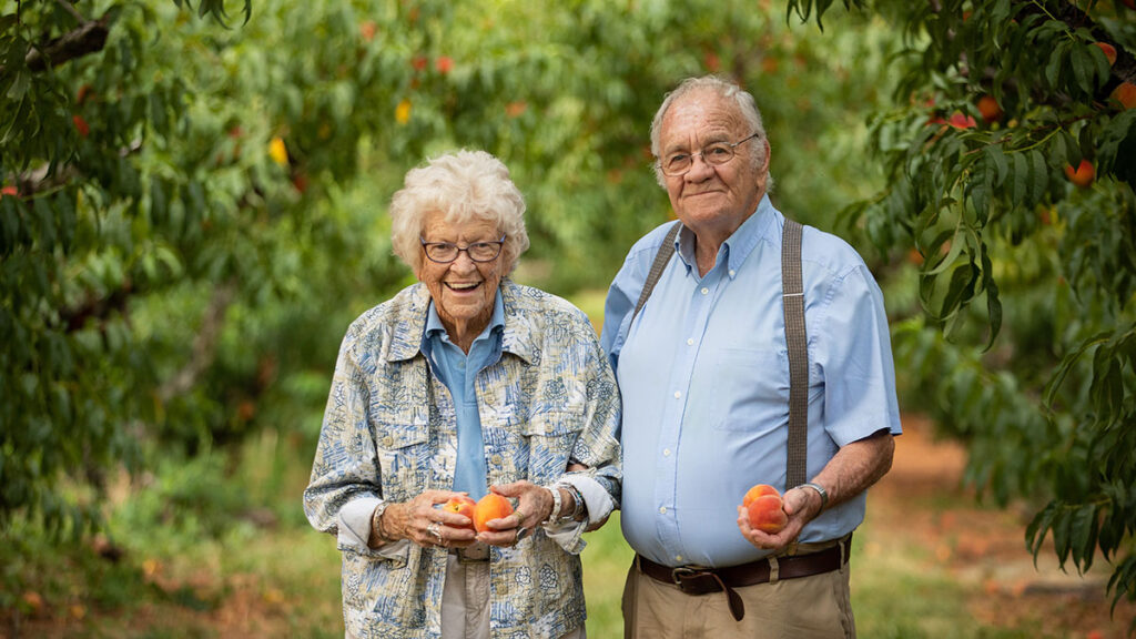 Ruth and Henry Chiles in the orchard