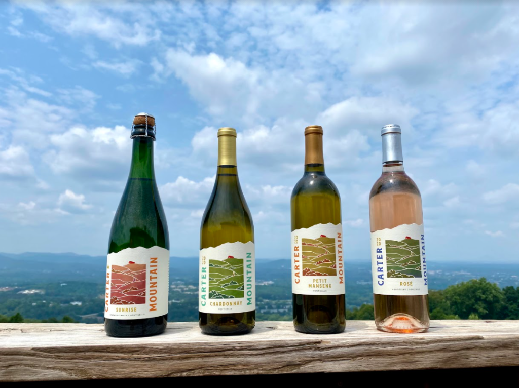 Carter Mountain Wine lineup with view