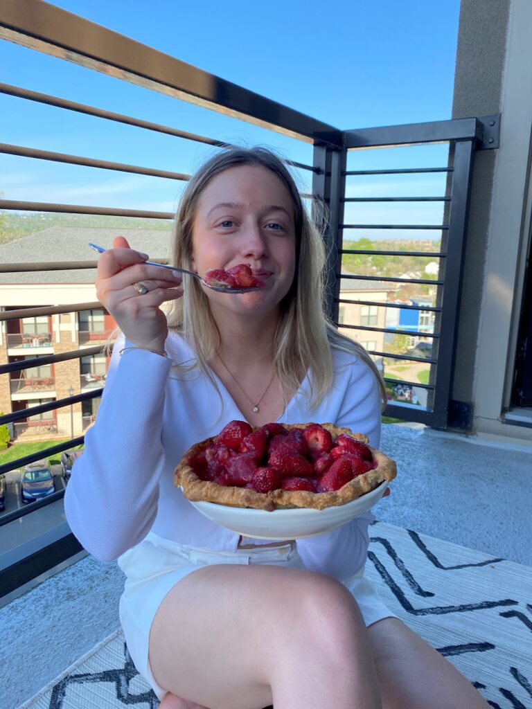 Girl eating fresh strawberry pie recipe