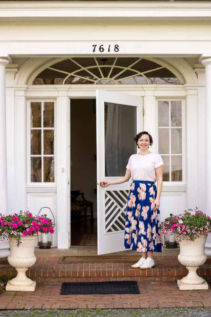 Amanda Gough, Chiswell Winery Tasting Room Manager, in doorway.