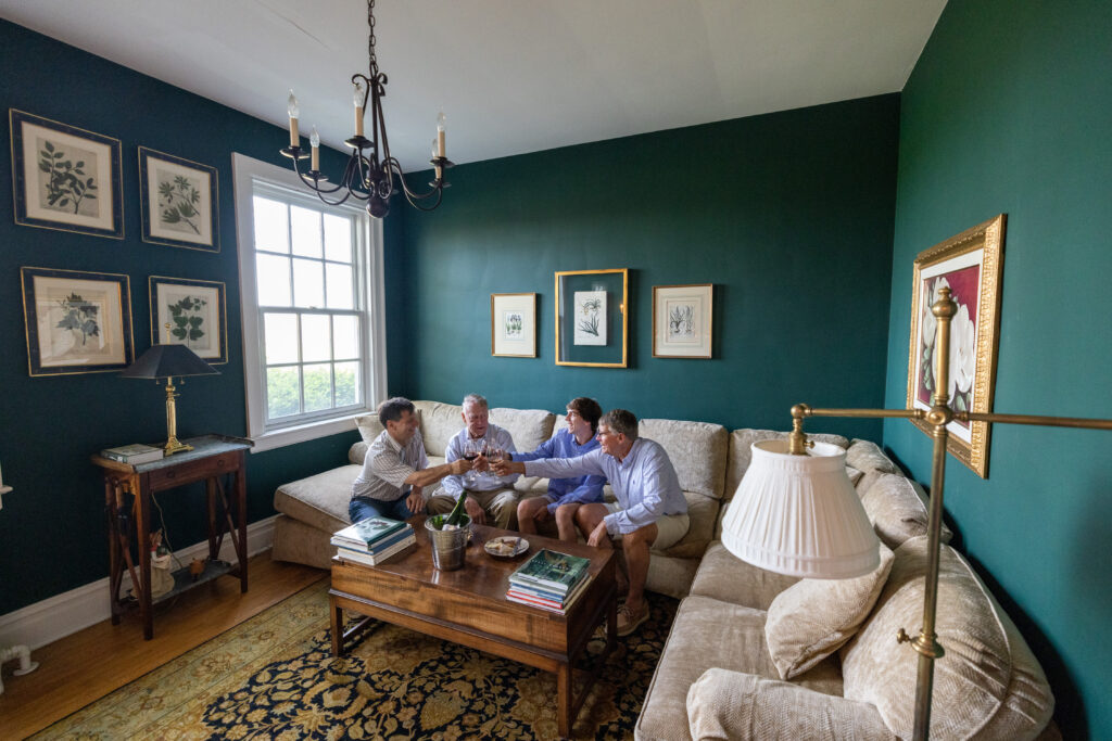 Men enjoying Sparkling Wine in Chiswell's Greenwood Room.