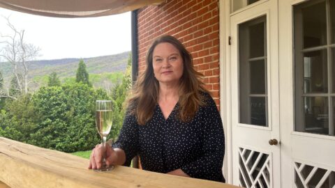 Woman with glass of white wine