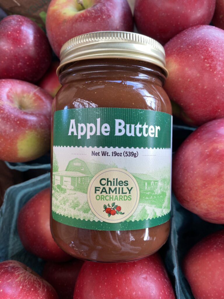 Apple butter jar on apples