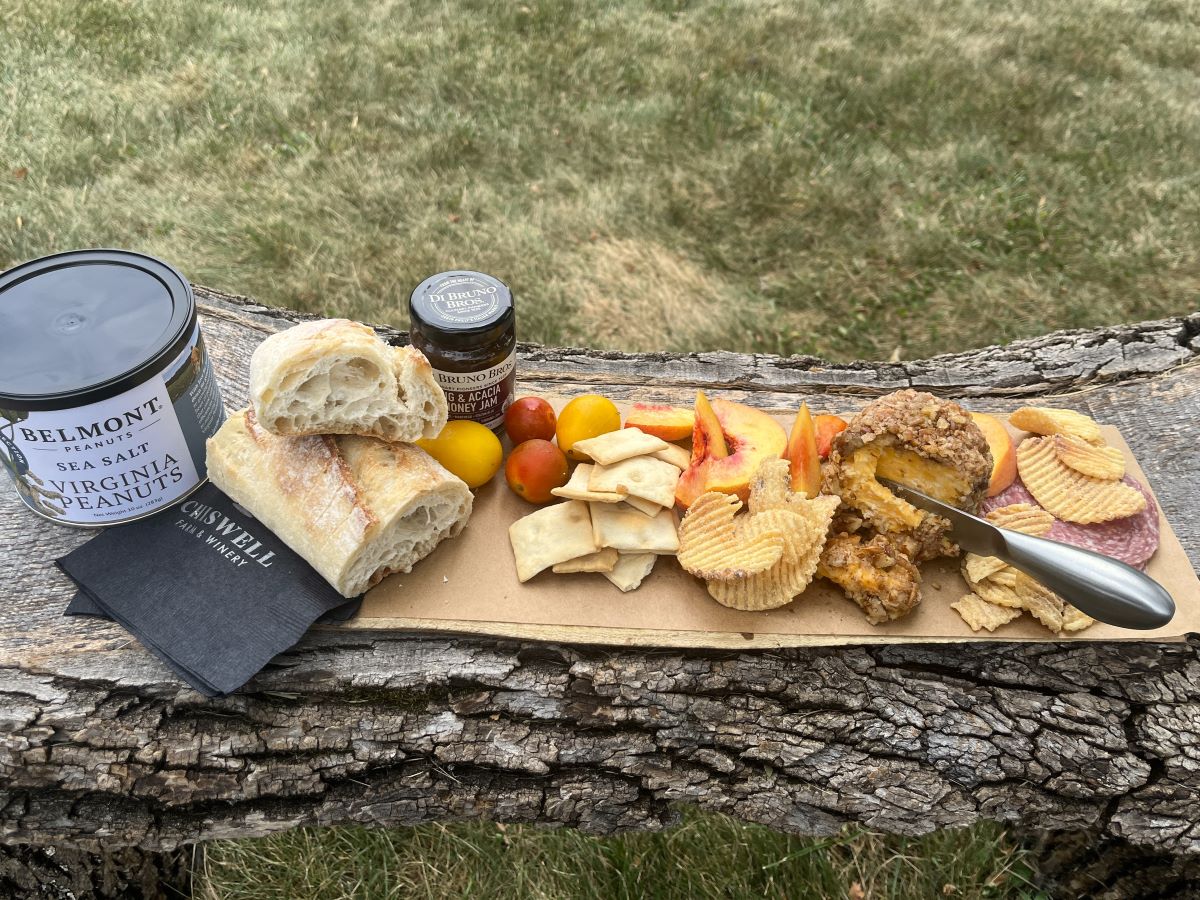 Charcuterie board with side snacks