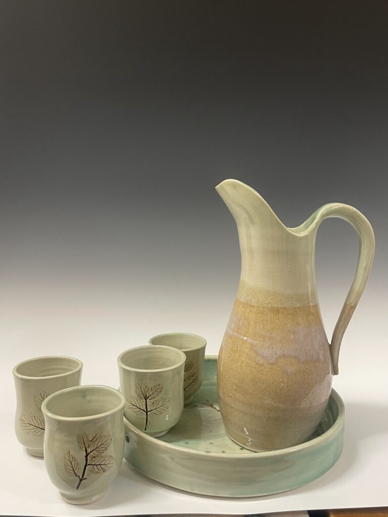 pottery cups and pitcher set