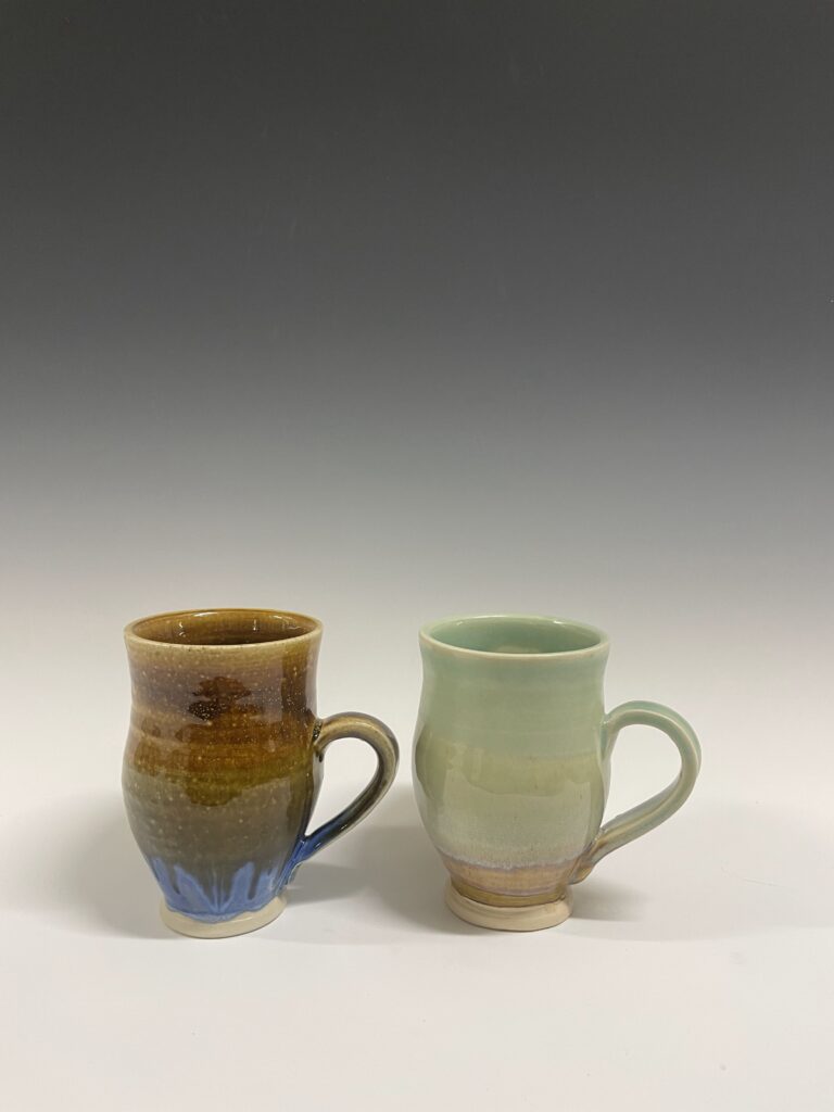 two pottery mugs