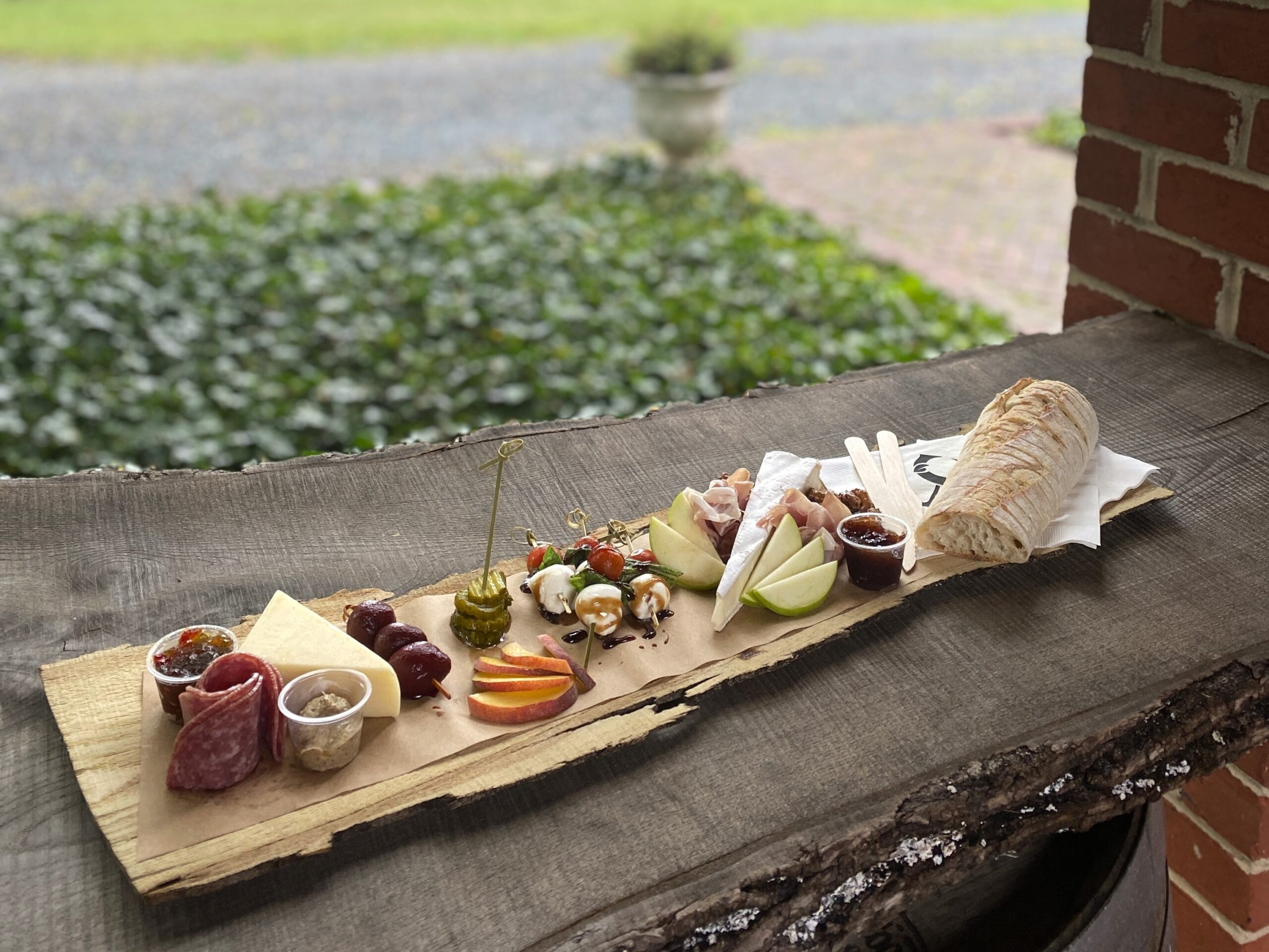 charcuterie board on a log