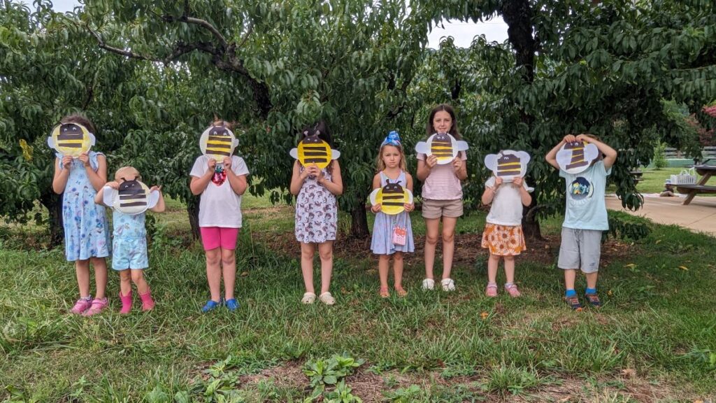 Kids with bumblebee crafts at Come Grow With Us