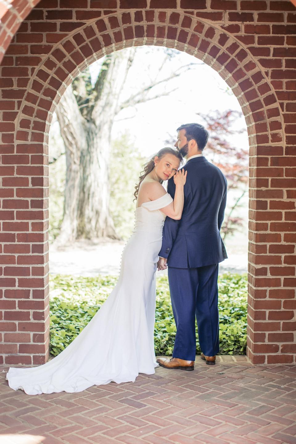 Couple in archway at Chiswell Winery wedding