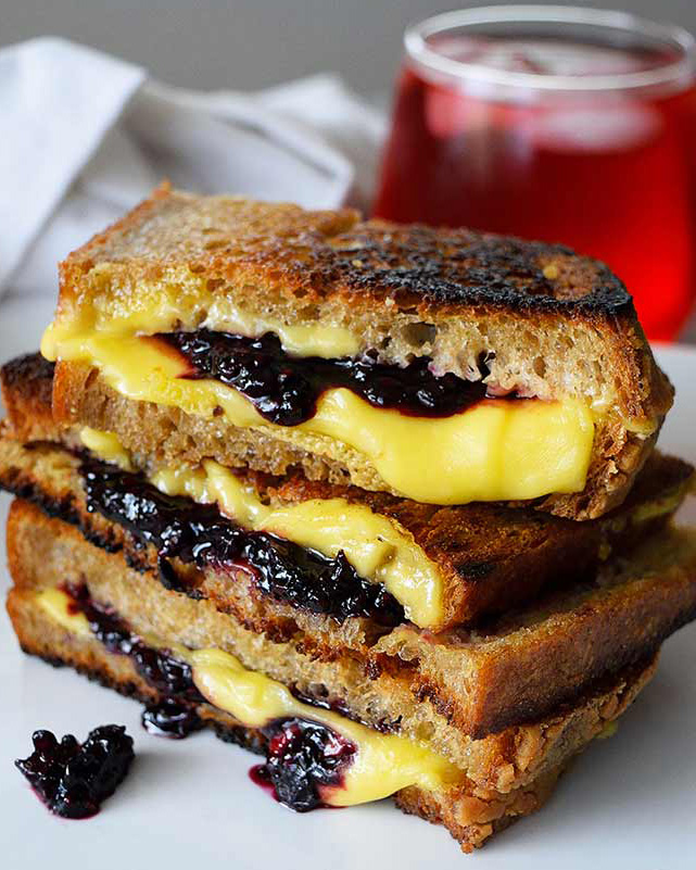 Griller cheese sandwiches with blackberries.