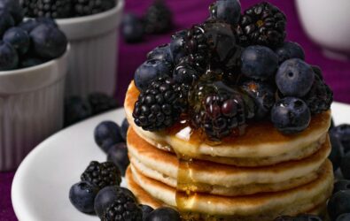 Pancakes with blueberries and blackberries.