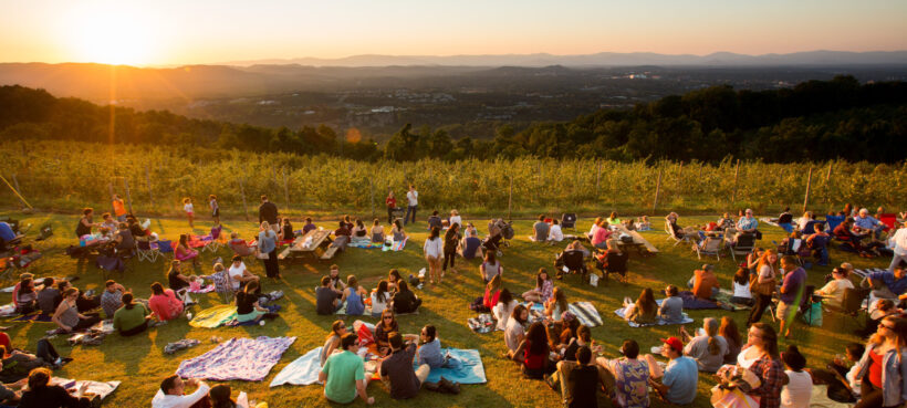 Visitors to Carter Mountain enjoying the sunset and live music.