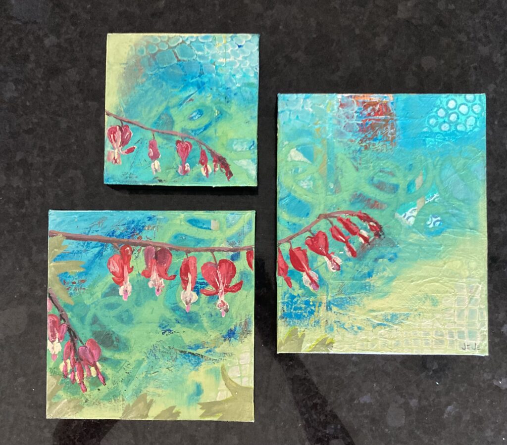 A set of three interconnected paintings depicting flowering branches by JeJe Moore.