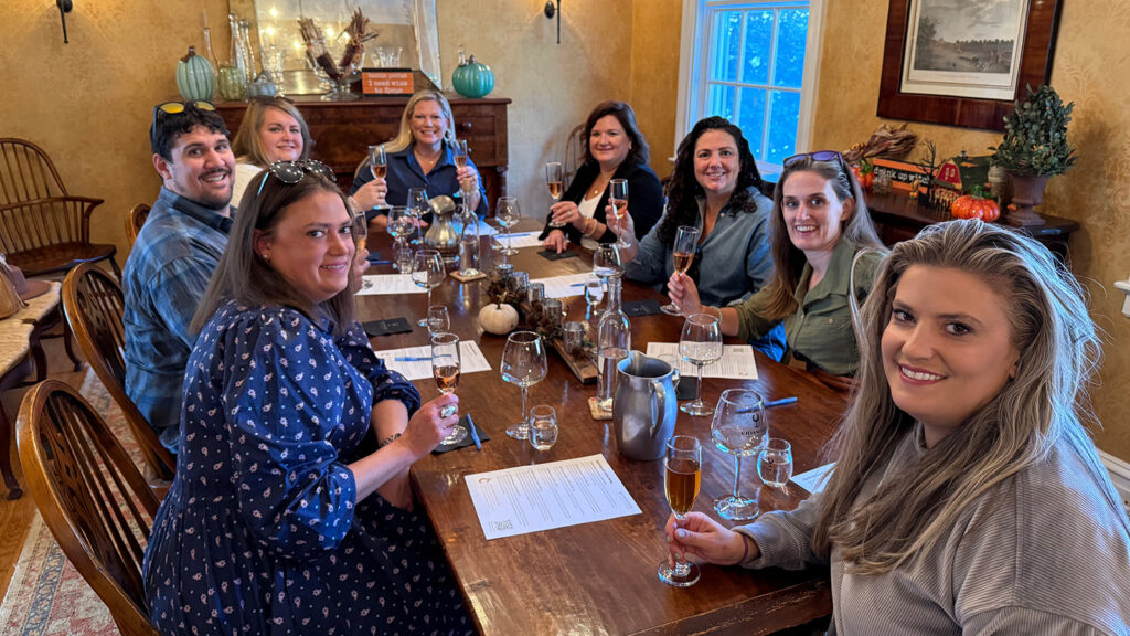 A group at a table enjoying wine at a Chiswell reserve tasting.