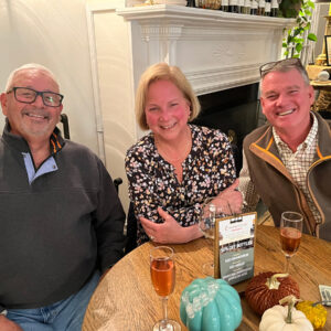 A group of three enjoying wine at Chiswell's Crown Club Members Night