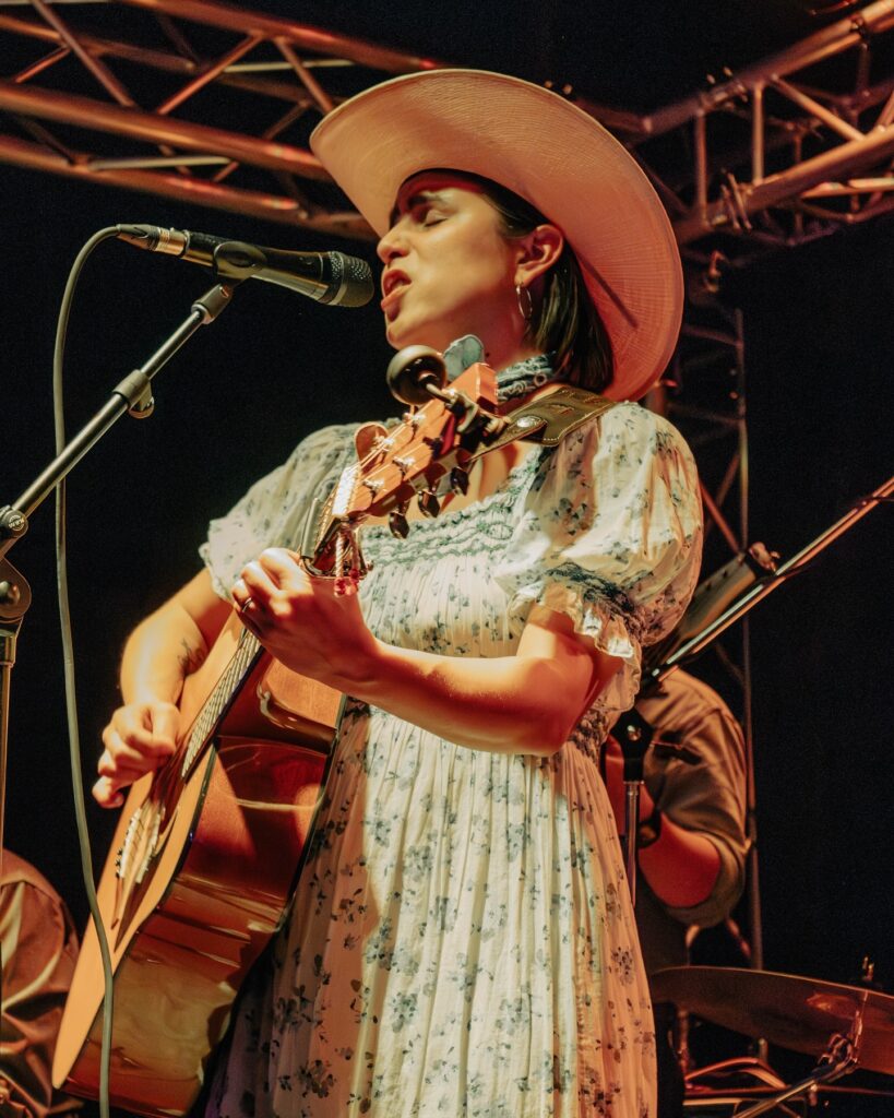 Musician Ramona Martinez playing guitar.