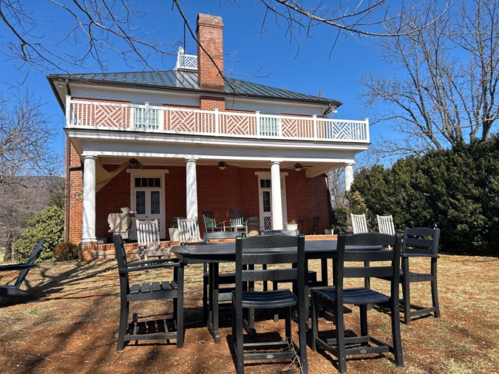 A historic Virginia estate in winter, with lawn chairs and a table