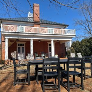 A historic Virginia estate in winter, with lawn chairs and a table