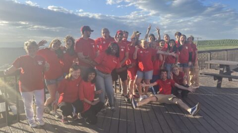 A group photo at sunset of Carter Mountain employees