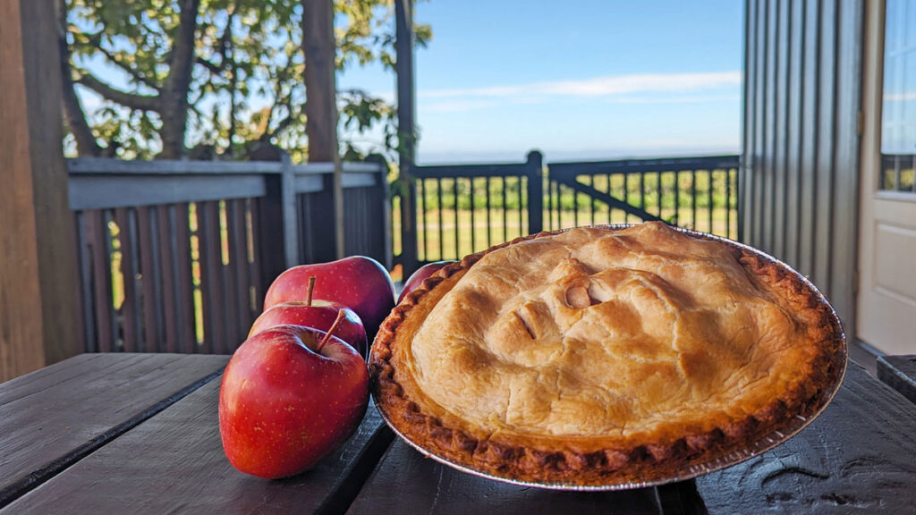 apple pie with apples next to it