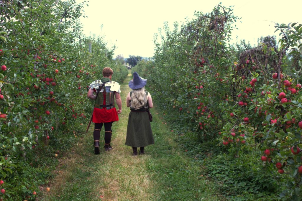 Roman soldier and witch in an apple orchard