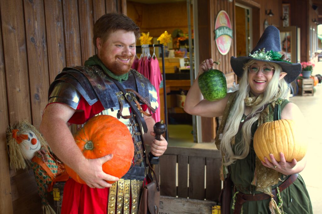 Roman soldier and witch with pumpkins