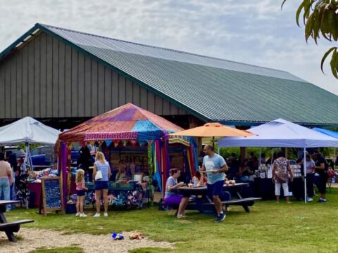vendors lined up at an orchard