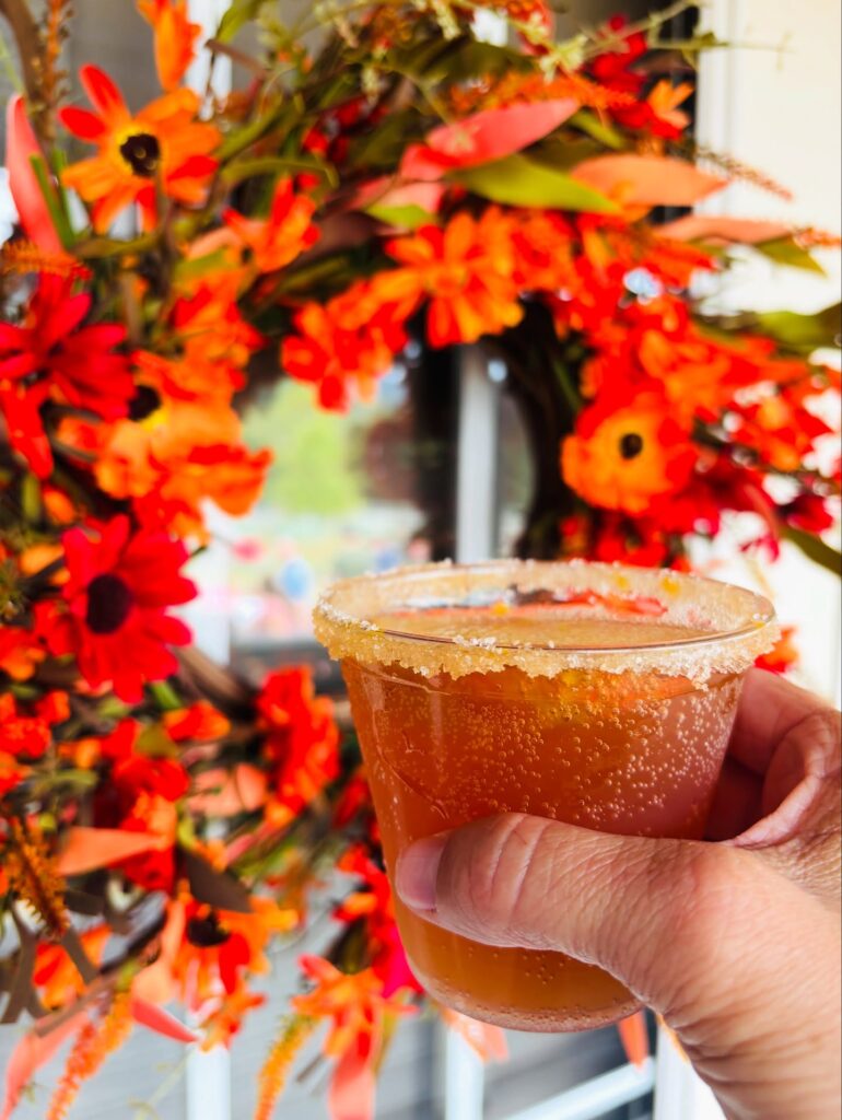 An apple cider slushie in front of a wreath