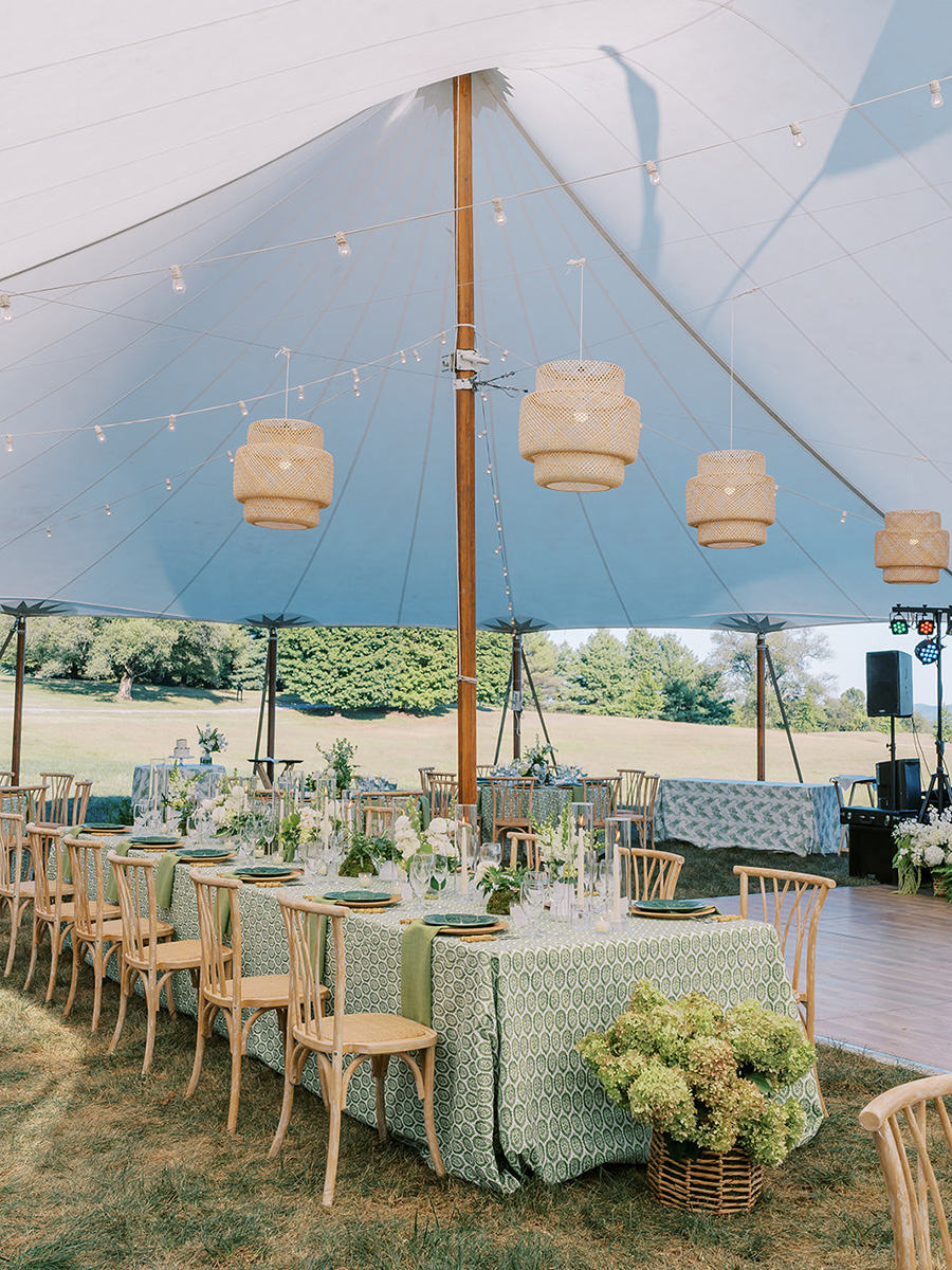 A wedding reception table in a pavilion outdoors