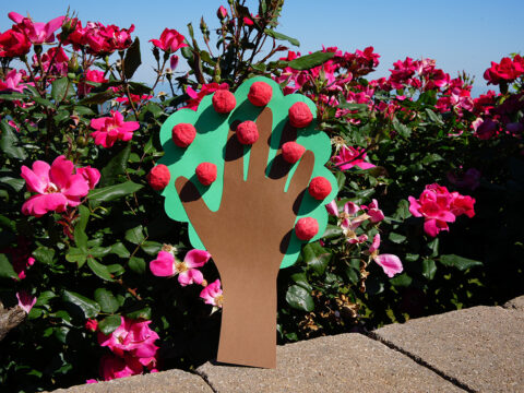 A crafted apple tree design using a handprint cutout
