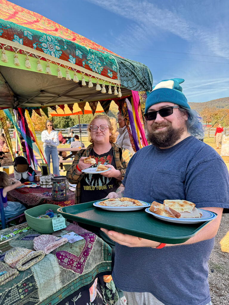 Two market stall vendors enjoying lunch outdoors