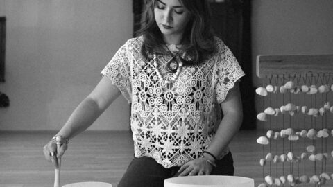 A black-and-white photo of a sound bath in progress