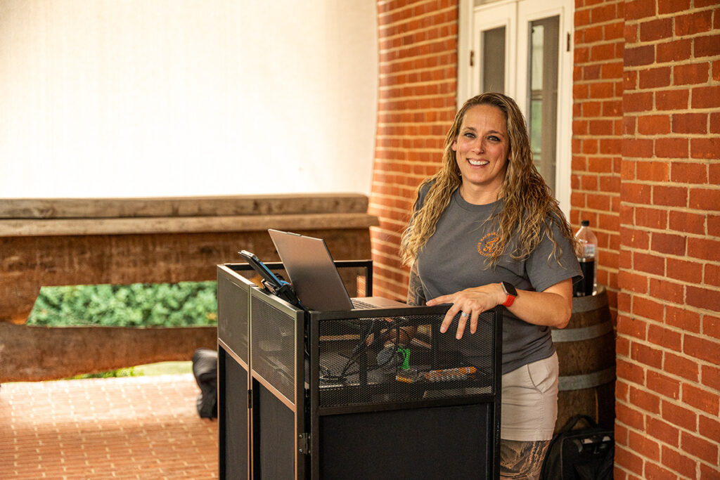 Rachael Karpo hosting a music event outdoors