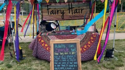An outdoor booth for GlimmerLocks fairy hair