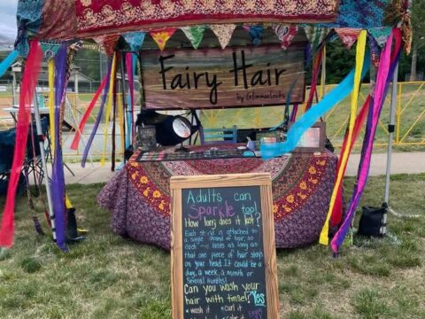 An outdoor booth for GlimmerLocks fairy hair