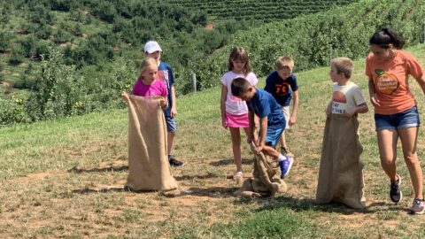 Kids participating in a sack race outdoors