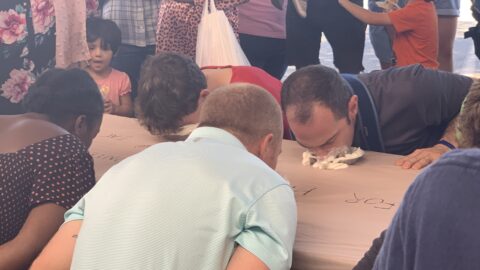 A pie eating contest where participants can't use their hands