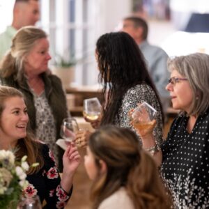 A group of people drinking wine indoors
