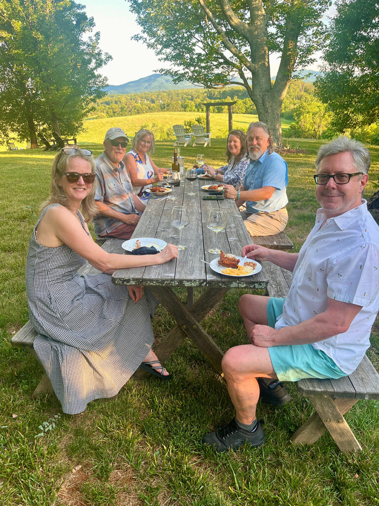 A group enjoying a picnic at a winery