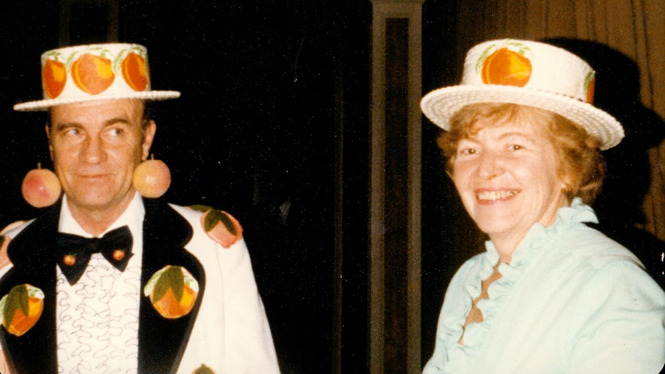 Henry and Ruth Chiles in peach outfits