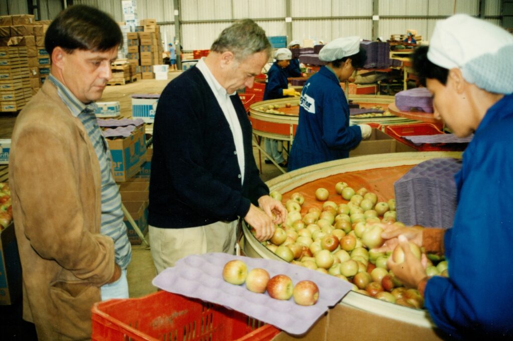 Henry Chiles inspecting apples being packed