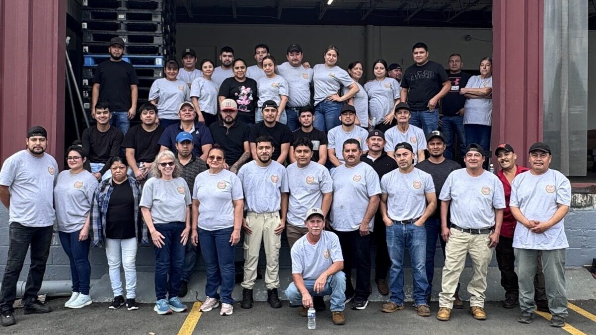 The Crown Orchard fruit packing staff wearing matching shirts